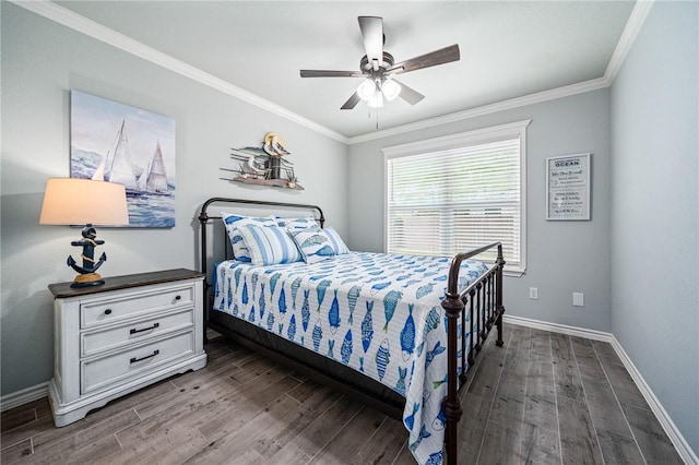 bedroom with baseboards, a ceiling fan, crown molding, and wood finished floors