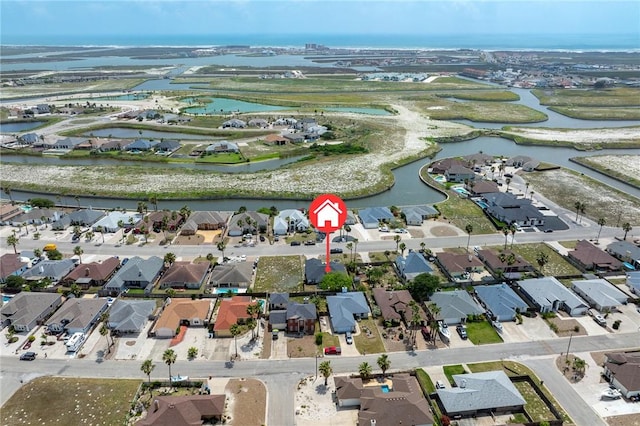 drone / aerial view featuring a water view and a residential view