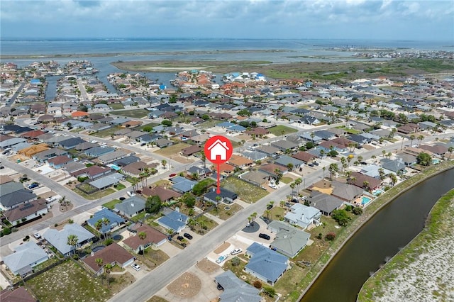 birds eye view of property featuring a residential view and a water view