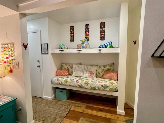 3938 Surfside Blvd Unit 2225, Corpus Christi, TX 78402 - bedroom with wood finished floors and baseboards