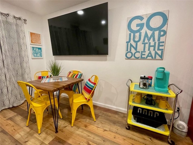 3938 Surfside Blvd Unit 2225, Corpus Christi, TX 78402 - dining room with hardwood / wood-style floors and baseboards