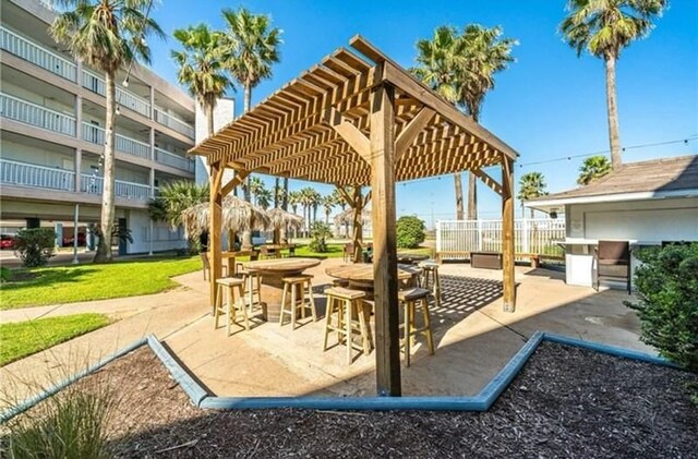3938 Surfside Blvd Unit 2225, Corpus Christi, TX 78402 - view of patio / terrace featuring a pergola