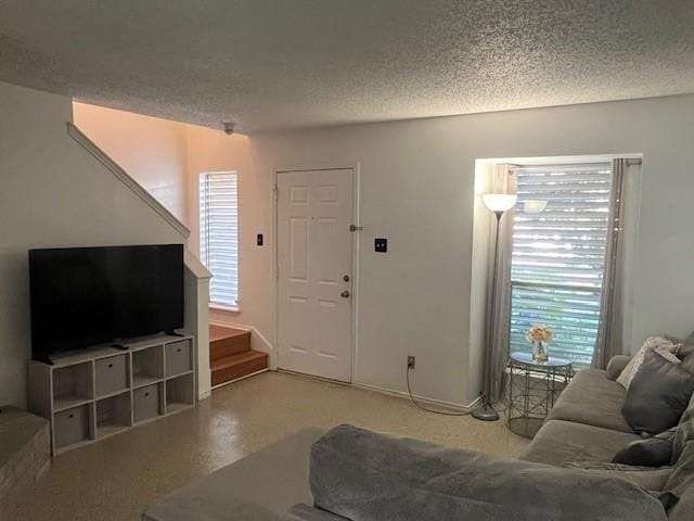 living room featuring a textured ceiling