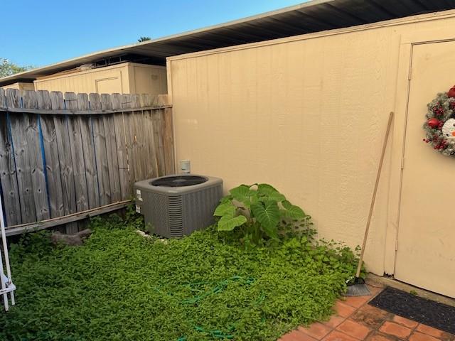 view of side of home featuring cooling unit