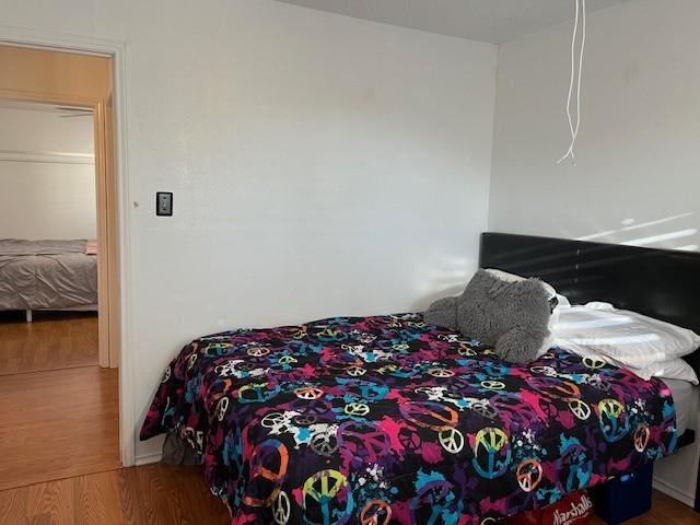 bedroom featuring hardwood / wood-style floors