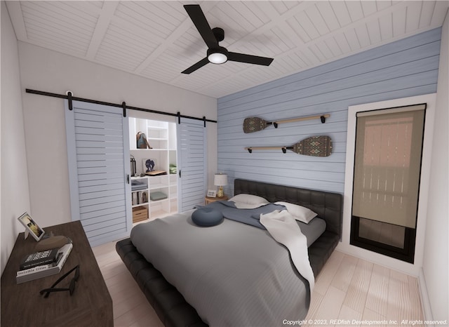 bedroom featuring light hardwood / wood-style floors, wood walls, a barn door, wooden ceiling, and ceiling fan