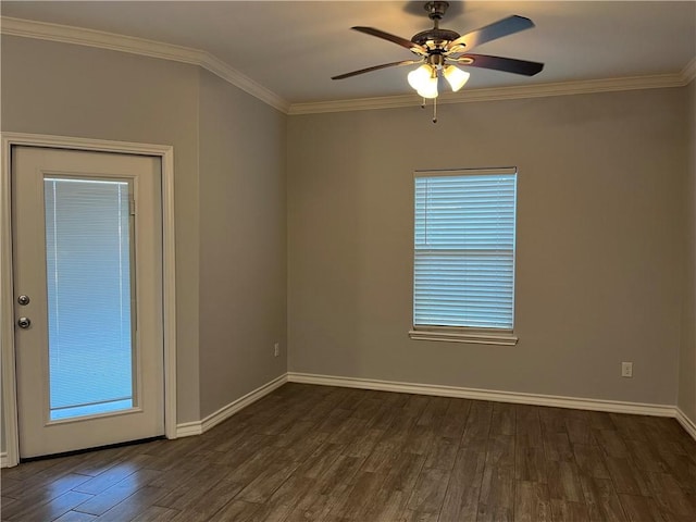 unfurnished room featuring dark wood-style floors, baseboards, ornamental molding, and a ceiling fan