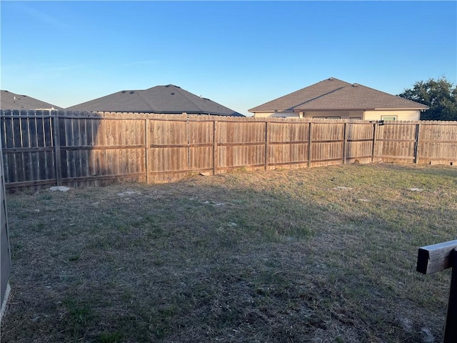 view of yard with a fenced backyard