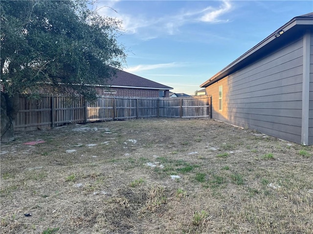 view of yard with a fenced backyard