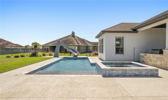 view of pool featuring a patio, a fenced backyard, a water slide, a fenced in pool, and an in ground hot tub