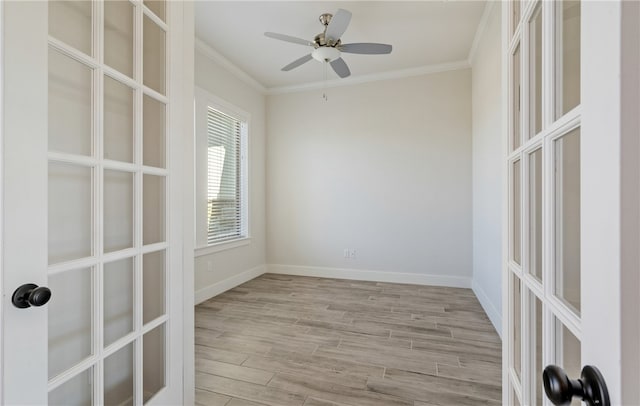 unfurnished room featuring wood finished floors, french doors, crown molding, baseboards, and ceiling fan