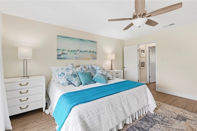 bedroom featuring hardwood / wood-style flooring and ceiling fan