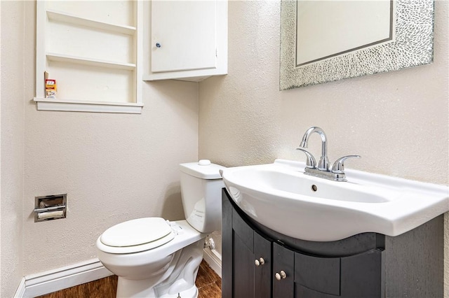 5905 Norvel Dr, Corpus Christi, TX 78412 - bathroom with vanity, a baseboard heating unit, and wood finished floors