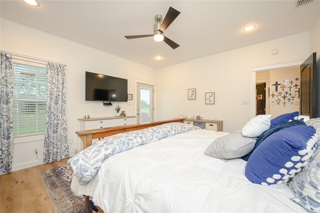 bedroom with ceiling fan and light wood-type flooring