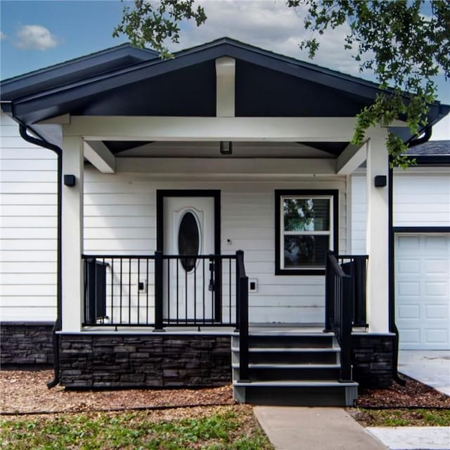 607 Matlock, Aransas Pass, TX 78336 - view of front of home featuring covered porch and an attached garage