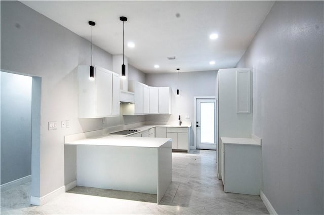 607 Matlock, Aransas Pass, TX 78336 - kitchen featuring a peninsula, black electric stovetop, decorative light fixtures, white cabinetry, and recessed lighting