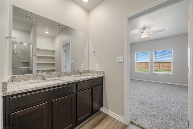 bathroom featuring vanity, hardwood / wood-style flooring, and ceiling fan