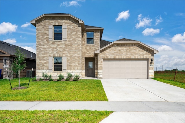 view of property with central AC unit, a garage, and a front lawn