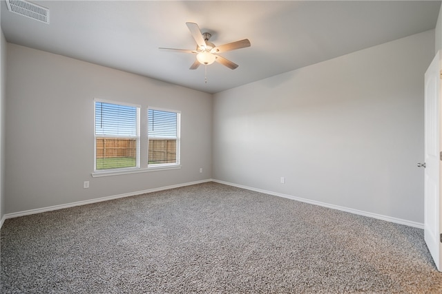 empty room featuring carpet and ceiling fan