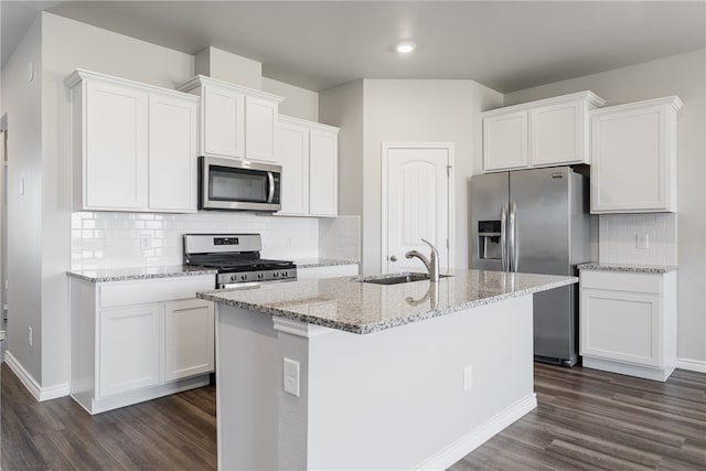 kitchen with sink, white cabinetry, stainless steel appliances, and dark wood-type flooring