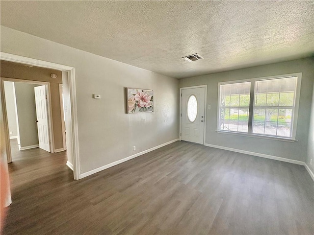 1230 Dona, Corpus Christi, TX 78407 - foyer featuring dark wood finished floors and a textured ceiling