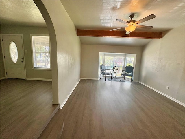 1230 Dona, Corpus Christi, TX 78407 - entrance foyer featuring arched walkways, wood finished floors, beamed ceiling, and a ceiling fan