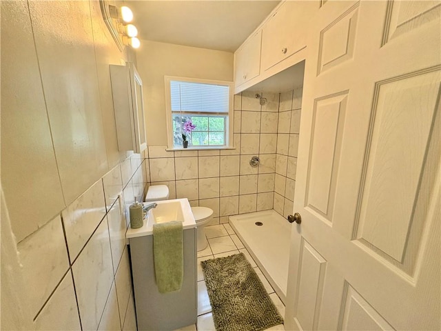 1230 Dona, Corpus Christi, TX 78407 - bathroom featuring tile walls, tile patterned flooring, tiled shower, and wainscoting