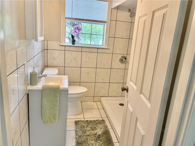 1230 Dona, Corpus Christi, TX 78407 - bathroom featuring tiled shower, tile patterned flooring, vanity, and tile walls