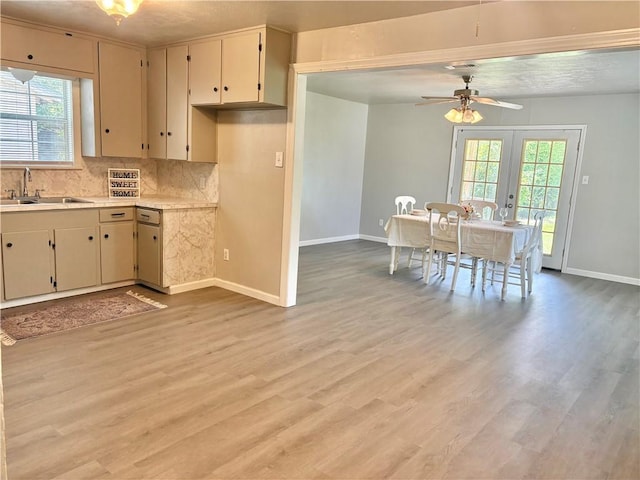 1230 Dona, Corpus Christi, TX 78407 - kitchen featuring decorative backsplash, french doors, light countertops, light wood-style floors, and a ceiling fan