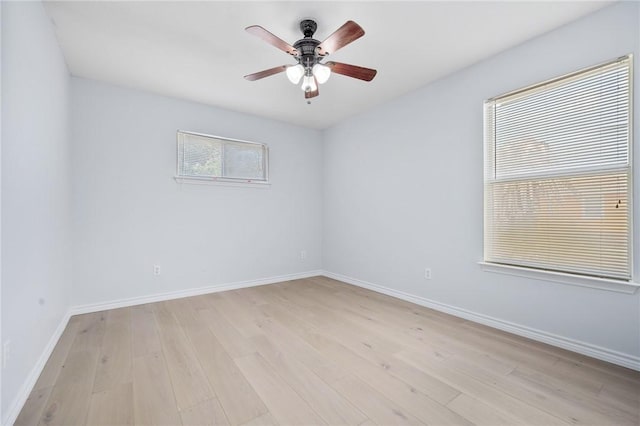 1003 S Pearl St, Rockport, TX 78382 - spare room with light wood-type flooring, a ceiling fan, and baseboards