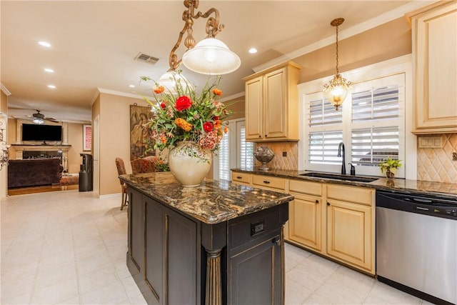 7001 Bevington Dr, Corpus Christi, TX 78413 - kitchen with stainless steel dishwasher, a sink, a ceiling fan, backsplash, and a kitchen island