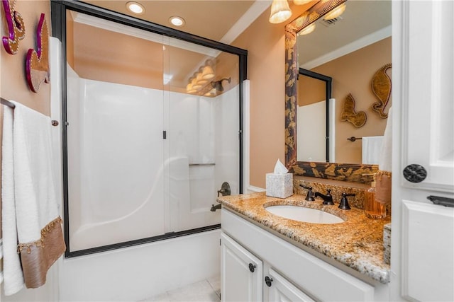 7001 Bevington Dr, Corpus Christi, TX 78413 - bathroom featuring combined bath / shower with glass door, vanity, and ornamental molding
