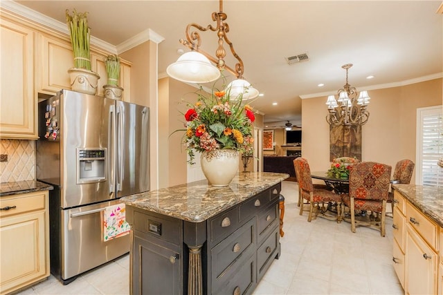 7001 Bevington Dr, Corpus Christi, TX 78413 - kitchen with stainless steel fridge with ice dispenser, ornamental molding, backsplash, a chandelier, and dark stone countertops