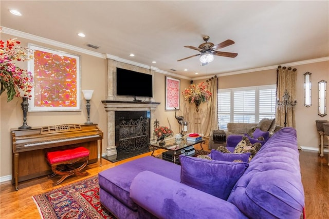 7001 Bevington Dr, Corpus Christi, TX 78413 - living room with ceiling fan, crown molding, wood finished floors, baseboards, and a large fireplace