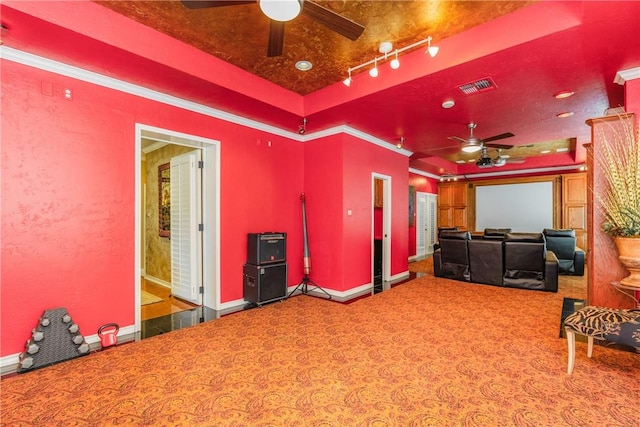 7001 Bevington Dr, Corpus Christi, TX 78413 - home theater room featuring ceiling fan, a raised ceiling, baseboards, carpet floors, and ornamental molding