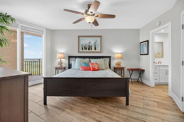 6649 Seacomber Dr Unit 807, Port Aransas, TX 78373 - bedroom featuring access to exterior, light wood-style floors, ensuite bathroom, and a ceiling fan