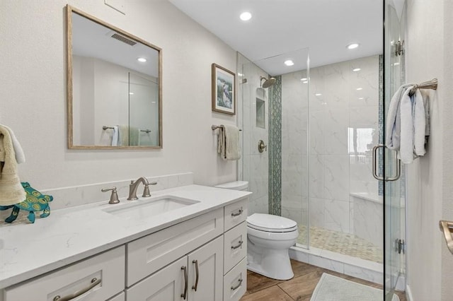 6649 Seacomber Dr Unit 807, Port Aransas, TX 78373 - bathroom featuring a stall shower, vanity, recessed lighting, and wood finished floors