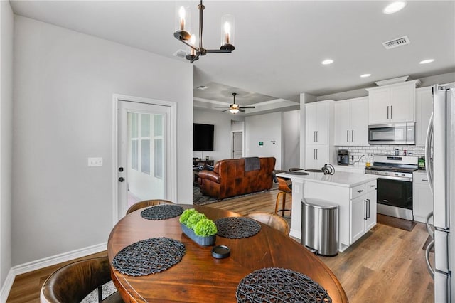 kitchen featuring visible vents, recessed lighting, appliances with stainless steel finishes, and wood finished floors