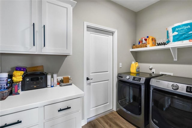 laundry room featuring washer and clothes dryer, cabinet space, and dark wood-style floors