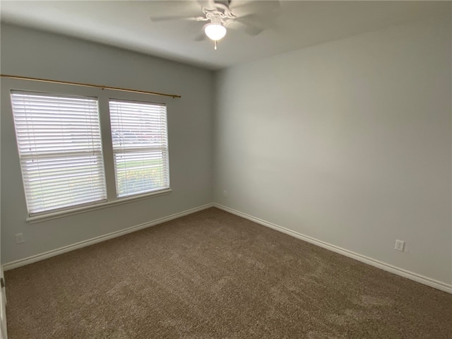 carpeted empty room with ceiling fan