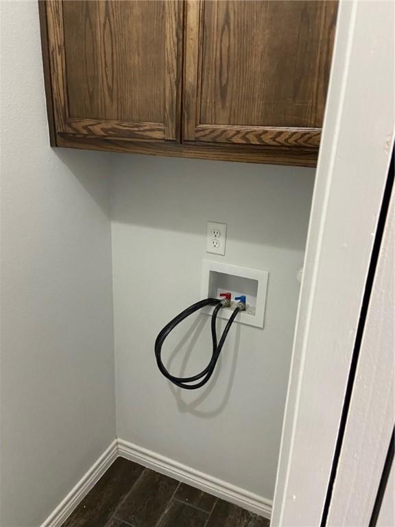 7618 Sable Creek Dr, Corpus Christi, TX 78414 - laundry area featuring cabinet space, baseboards, washer hookup, and dark wood-style floors