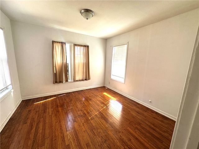 empty room featuring dark wood-type flooring