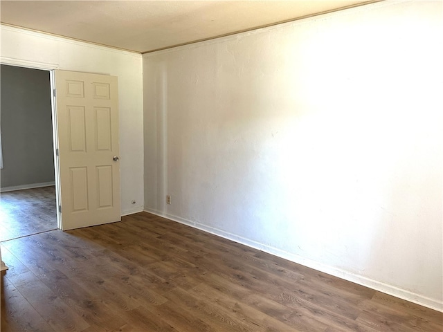 unfurnished room featuring dark hardwood / wood-style flooring