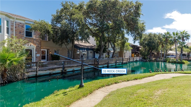 view of swimming pool with a lawn