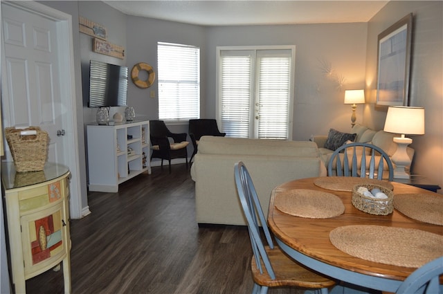 dining space with dark hardwood / wood-style floors