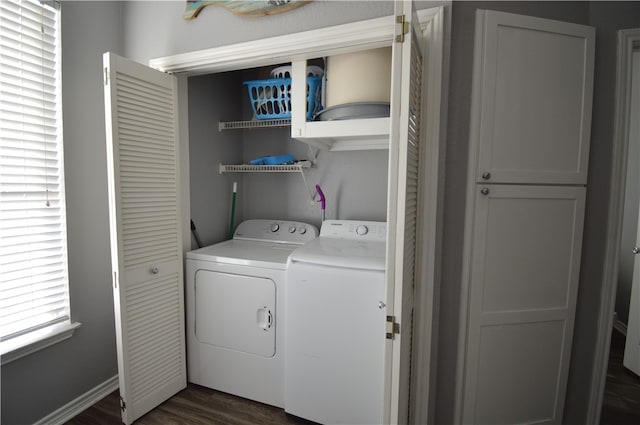 washroom with dark hardwood / wood-style flooring and independent washer and dryer