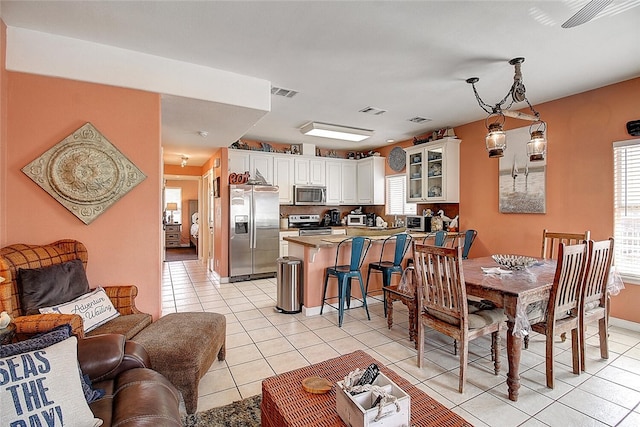141 Mustang Royale Blvd, Port Aransas, TX 78373 - dining room with light tile patterned floors
