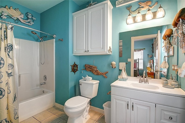 141 Mustang Royale Blvd, Port Aransas, TX 78373 - full bath with toilet, tile patterned floors, shower / bathtub combination with curtain, vanity, and baseboards