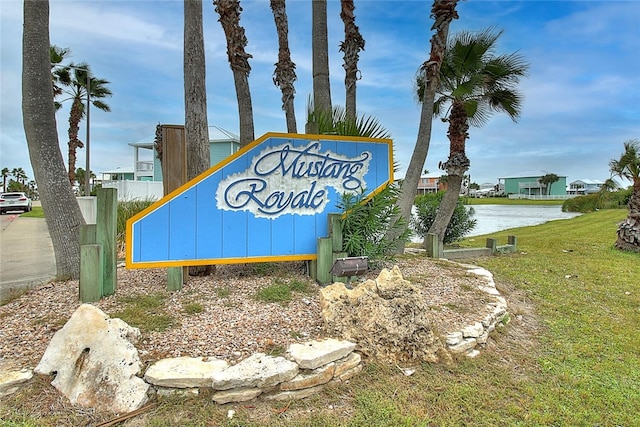 141 Mustang Royale Blvd, Port Aransas, TX 78373 - community / neighborhood sign featuring a water view and a yard