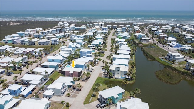 141 Mustang Royale Blvd, Port Aransas, TX 78373 - aerial view of property and surrounding area with a large body of water and nearby suburban area